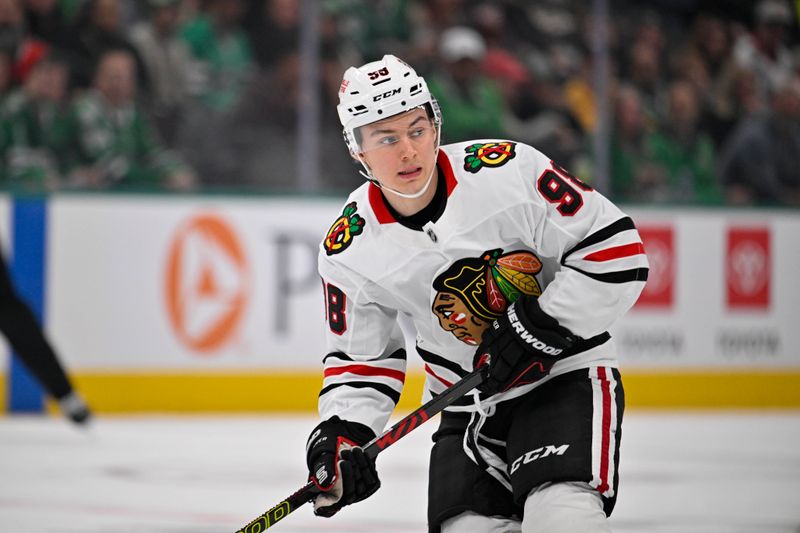 Nov 7, 2024; Dallas, Texas, USA; Chicago Blackhawks center Connor Bedard (98) skates against the Dallas Stars during the first period at the American Airlines Center. Mandatory Credit: Jerome Miron-Imagn Images