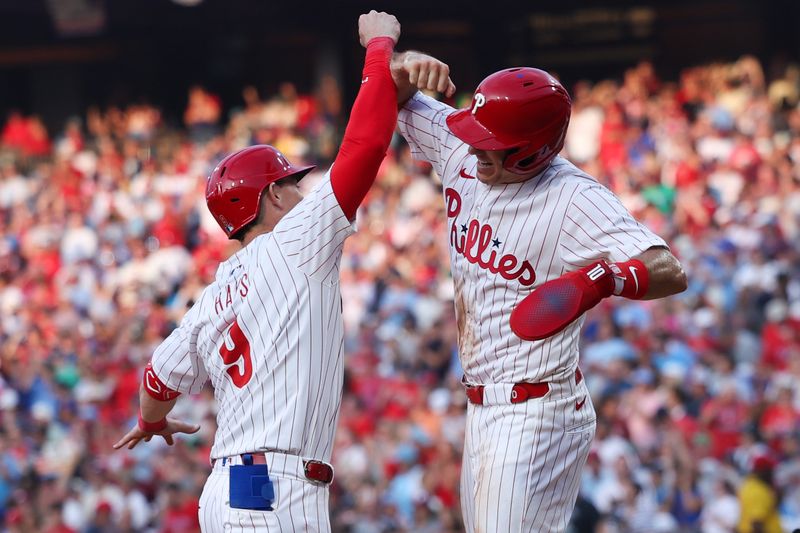Jul 30, 2024; Philadelphia, Pennsylvania, USA; Philadelphia Phillies outfielder Austin Hays (9) celebrates with catcher J.T. Realmuto (10) after hitting a three RBI home run during the second inning against the New York Yankees at Citizens Bank Park. Mandatory Credit: Bill Streicher-USA TODAY Sports