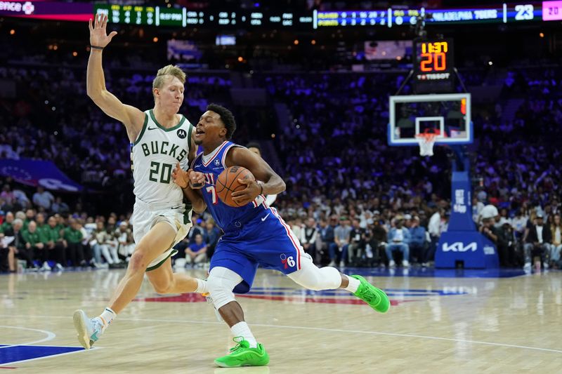 PHILADELPHIA, PENNSYLVANIA - OCTOBER 23: Kyle Lowry #7 of the Philadelphia 76ers drives to the basket against AJ Green #20 of the Milwaukee Bucks in the first half at the Wells Fargo Center on October 23, 2024 in Philadelphia, Pennsylvania. NOTE TO USER: User expressly acknowledges and agrees that, by downloading and/or using this photograph, user is consenting to the terms and conditions of the Getty Images License Agreement. (Photo by Mitchell Leff/Getty Images)