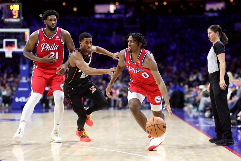 PHILADELPHIA, PENNSYLVANIA - DECEMBER 15: Tyrese Maxey #0 of the Philadelphia 76ers drives past Jaden Ivey #23 of the Detroit Pistons during the third quarter at the Wells Fargo Center on December 15, 2023 in Philadelphia, Pennsylvania. NOTE TO USER: User expressly acknowledges and agrees that, by downloading and or using this photograph, User is consenting to the terms and conditions of the Getty Images License Agreement. (Photo by Tim Nwachukwu/Getty Images)