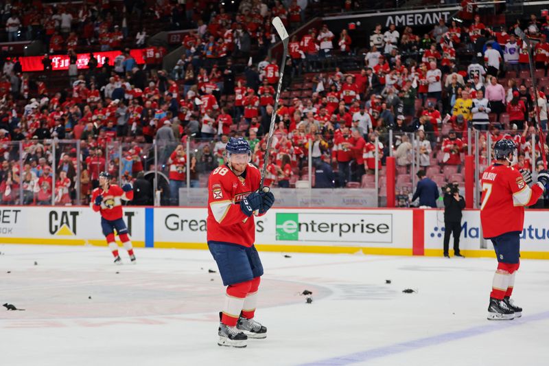 May 24, 2025; Sunrise, Florida, USA; The Florida Panthers celebrate the win against the Carolina Hurricanes in game three of the Eastern Conference Final of the 2025 Stanley Cup Playoffs at Amerant Bank Arena. Mandatory Credit: Sam Navarro-Imagn Images