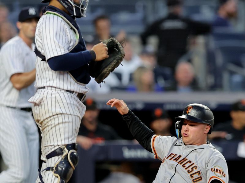 Apr 1, 2023; Bronx, New York, USA; San Francisco Giants designated hitter Joc Pederson (23) scores in front of New York Yankees catcher Jose Trevino (39) on a double by Giants center fielder Mike Yastrzemski (not pictured) during the ninth inning at Yankee Stadium. Mandatory Credit: Brad Penner-USA TODAY Sports