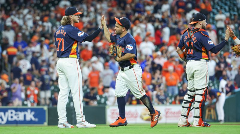 Apr 14, 2024; Houston, Texas, USA; Houston Astros second baseman Jose Altuve (27) celebrates with pitcher Josh Hader (71) after the game at Minute Maid Park. Mandatory Credit: Troy Taormina-USA TODAY Sports