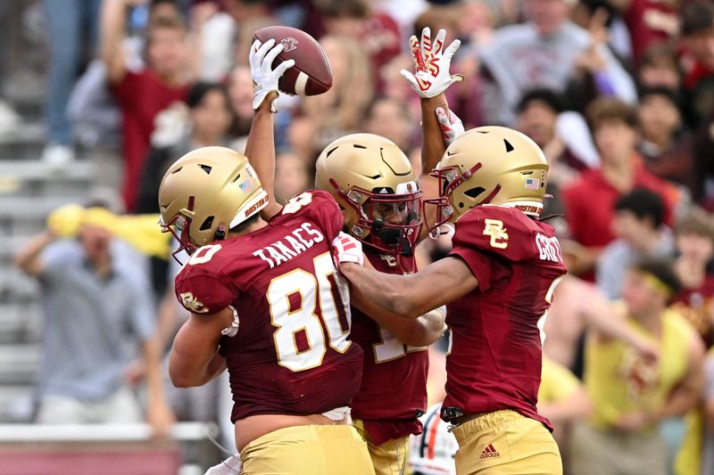 Sep 30, 2023; Chestnut Hill, Massachusetts, USA; Boston College Eagles wide receiver Lewis Bond (11) celebrates withwide receiver Joseph Griffin Jr. (2) and tight end George Takacs (80) after scoring a touchdown against the Virginia Cavaliers during the second half at Alumni Stadium. Mandatory Credit: Brian Fluharty-USA TODAY Sports