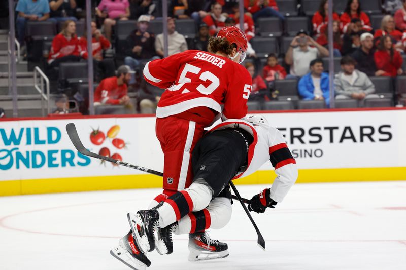 Oct 4, 2024; Detroit, Michigan, USA;  Detroit Red Wings defenseman Moritz Seider (53) shoves Ottawa Senators center Jan Jenik (14) in the first period at Little Caesars Arena. Mandatory Credit: Rick Osentoski-Imagn Images