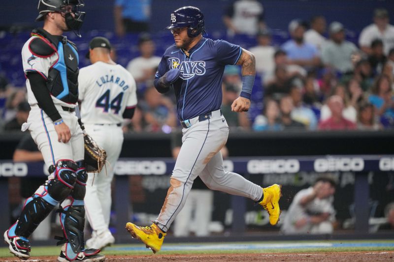 Jun 4, 2024; Miami, Florida, USA; Tampa Bay Rays designated hitter Harold Ramírez (43) scores a run against the Miami Marlins in the fifth inning at loanDepot Park. Mandatory Credit: Jim Rassol-USA TODAY Sports