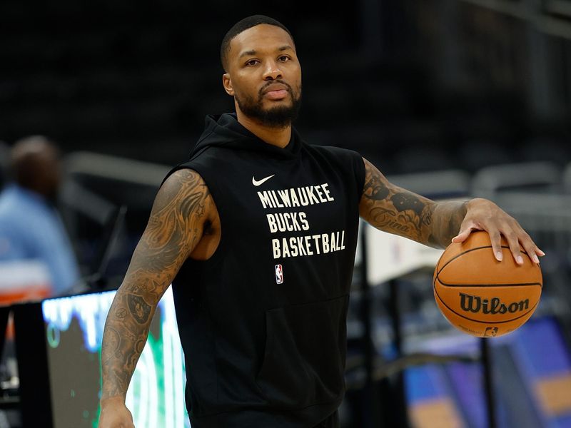 MILWAUKEE, WISCONSIN - OCTOBER 20: Damian Lillard #0 of the Milwaukee Bucks warms up before the preseason game against the Memphis Grizzlies at Fiserv Forum on October 20, 2023 in Milwaukee, Wisconsin. NOTE TO USER: User expressly acknowledges and agrees that, by downloading and or using this photograph, User is consenting to the terms and conditions of the Getty Images License Agreement. (Photo by John Fisher/Getty Images)