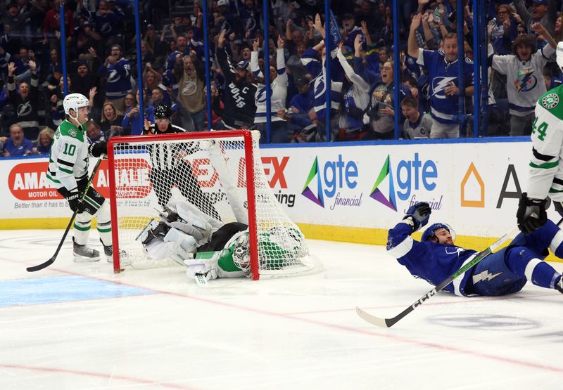 Dec 4, 2023; Tampa, Florida, USA; Tampa Bay Lightning center Luke Glendening (11) scores a goal past Dallas Stars defenseman Joel Hanley (44) on goaltender Jake Oettinger (29)  during the third period at Amalie Arena. Mandatory Credit: Kim Klement Neitzel-USA TODAY Sports