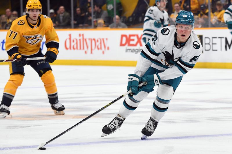 Mar 19, 2024; Nashville, Tennessee, USA; San Jose Sharks left wing Fabian Zetterlund (20) skates with the puck during the second period against the Nashville Predators at Bridgestone Arena. Mandatory Credit: Christopher Hanewinckel-USA TODAY Sports