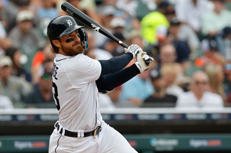 Aug 6, 2023; Detroit, Michigan, USA; Detroit Tigers catcher Eric Haase (13) hits an RBI single in the second inning against the Tampa Bay Rays at Comerica Park. Mandatory Credit: Rick Osentoski-USA TODAY Sports