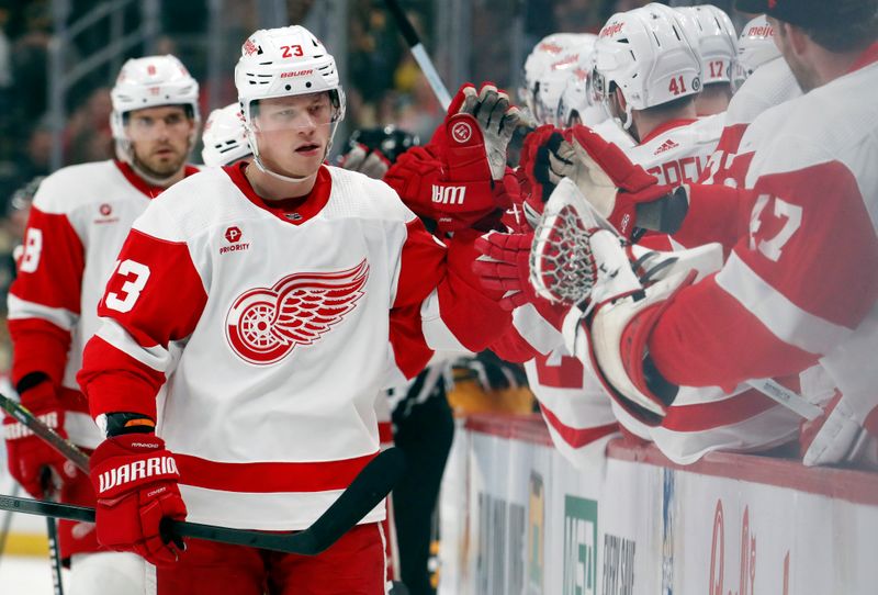 Apr 11, 2024; Pittsburgh, Pennsylvania, USA; Detroit Red Wings left wing Lucas Raymond (23) celebrates with the Red Wings bench far scoring a goal against the Pittsburgh Penguins during the first period at PPG Paints Arena. Mandatory Credit: Charles LeClaire-USA TODAY Sports