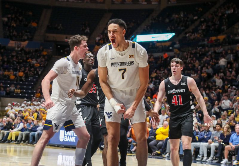 Jan 31, 2024; Morgantown, West Virginia, USA; West Virginia Mountaineers center Jesse Edwards (7) celebrates after a score during the second half against the Cincinnati Bearcats at WVU Coliseum. Mandatory Credit: Ben Queen-USA TODAY Sports