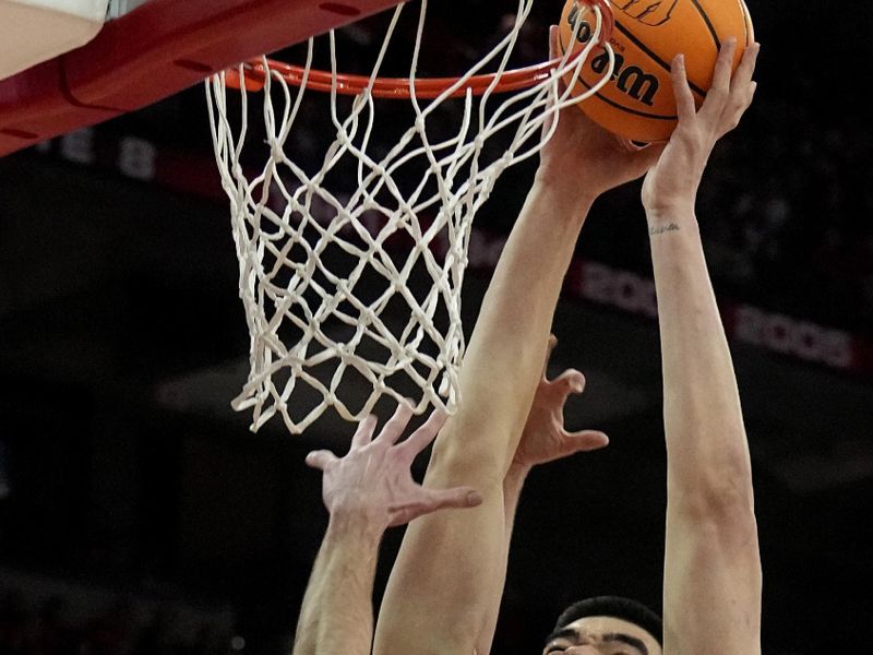 Mar. 2, 2023; Milwaukee, Wisconsin, USA; Purdue Boilermakers center Zach Edey (15) misses a dunk while being defended by Wisconsin Badgers forward Tyler Wahl (5) and guard Max Klesmit (11) during the first half of their game at Kohl Center. Mandatory Credit: Mark Hoffman-USA TODAY Sports