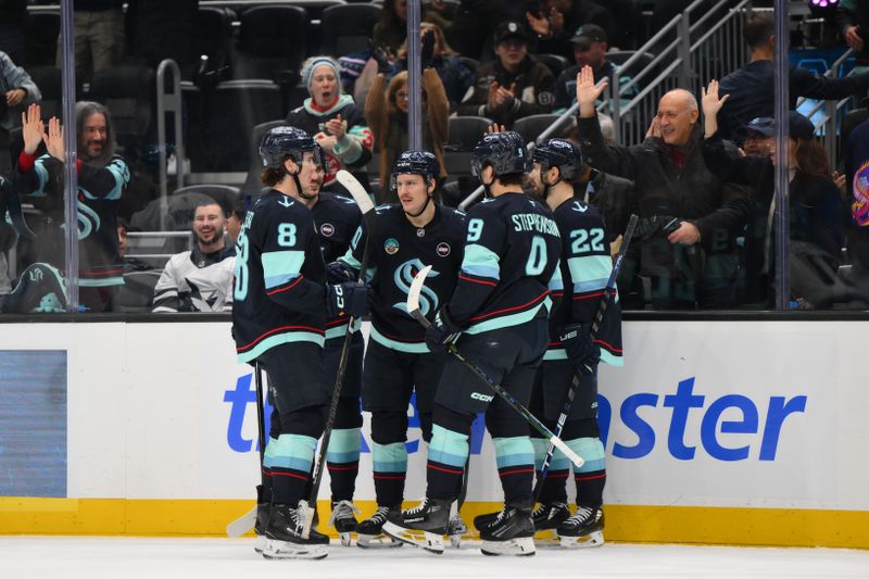 Jan 30, 2025; Seattle, Washington, USA; The Seattle Kraken celebrate after a goal scored by right wing Eeli Tolvanen (20) during the third period against the San Jose Sharks at Climate Pledge Arena. Mandatory Credit: Steven Bisig-Imagn Images