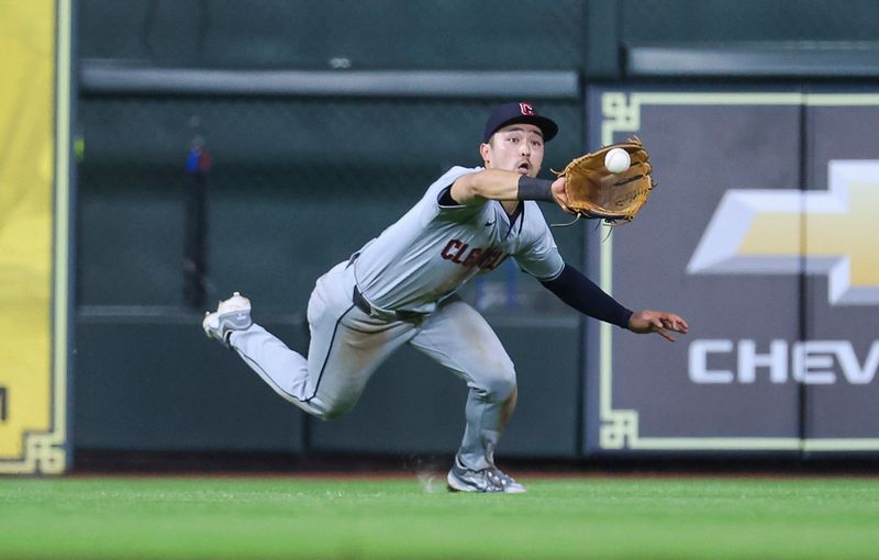 May 1, 2024; Houston, Texas, USA;  Cleveland Guardians left fielder Steven Kwan (38) makes a diving catch during the tenth inning against the Houston Astros at Minute Maid Park. Mandatory Credit: Troy Taormina-USA TODAY Sports