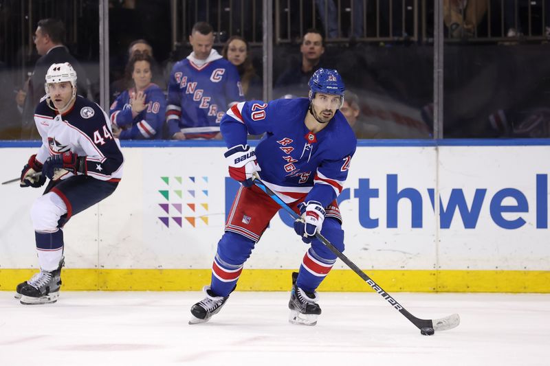 Feb 28, 2024; New York, New York, USA; New York Rangers left wing Chris Kreider (20) controls the puck against Columbus Blue Jackets defenseman Erik Gudbranson (44) during the second period at Madison Square Garden. Mandatory Credit: Brad Penner-USA TODAY Sports