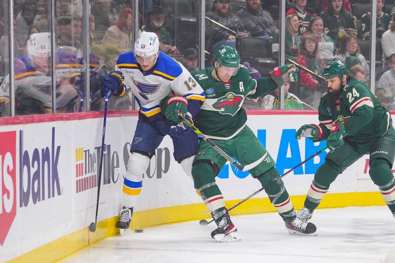 Nov 28, 2023; Saint Paul, Minnesota, USA; Minnesota Wild left wing Marcus Foligno (17) checks St. Louis Blues right wing Alexey Toropchenko (13) in the first period at Xcel Energy Center. Mandatory Credit: Brad Rempel-USA TODAY Sports