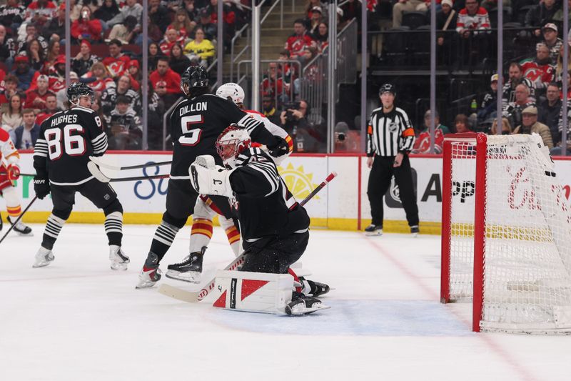 Mar 12, 2026; Newark, New Jersey, USA; Calgary Flames defenseman Kevin Bahl (7) (not shown) scores a goal on New Jersey Devils goaltender Jacob Markstrom (25) during the first period at Prudential Center. Mandatory Credit: Ed Mulholland-Imagn Images