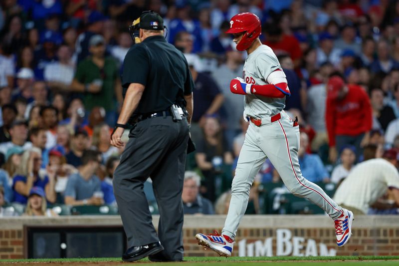 Jul 2, 2024; Chicago, Illinois, USA; Philadelphia Phillies shortstop Trea Turner (7) crosses home plate after hitting a two-run home run against the Chicago Cubs during the fifth inning at Wrigley Field. Mandatory Credit: Kamil Krzaczynski-USA TODAY Sports