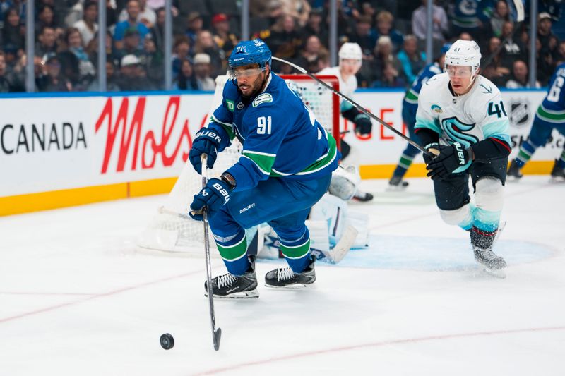 Sep 26, 2025; Vancouver, British Columbia, CAN; Vancouver Canucks forward Evander Kane (91) handles the puck against the Seattle Kraken in the third period at Rogers Arena. Mandatory Credit: Bob Frid-Imagn Images