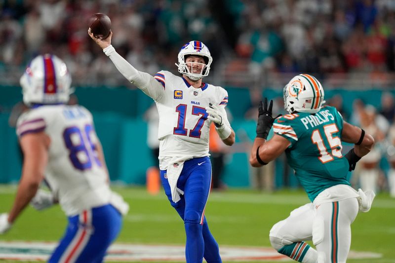 Buffalo Bills quarterback Josh Allen (17) aims a pass during the first half of an NFL football game against the Miami Dolphins, Thursday, Sept. 12, 2024, in Miami Gardens, Fla. (AP Photo/Rebecca Blackwell)