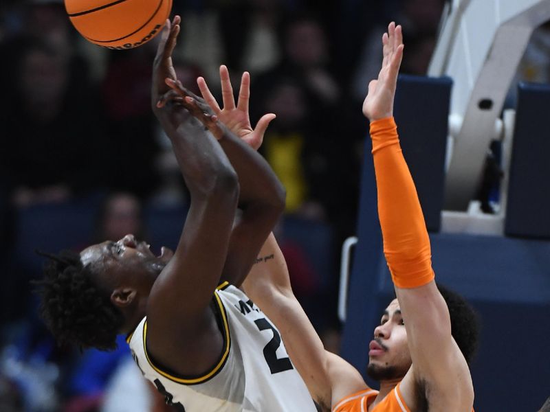 Mar 10, 2023; Nashville, TN, USA; Missouri Tigers guard Kobe Brown (24) is fouled by Tennessee Volunteers forward Olivier Nkamhoua (13) during the second half at Bridgestone Arena. Mandatory Credit: Christopher Hanewinckel-USA TODAY Sports