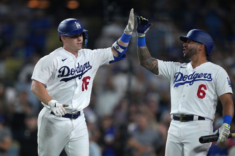 Aug 29, 2023; Los Angeles, California, USA; Los Angeles Dodgers catcher Will Smith (16) celebrates with designated hitter David Peralta (6) after hitting a home run in the sixth inning against the Arizona Diamondbacks at Dodger Stadium. Mandatory Credit: Kirby Lee-USA TODAY Sports