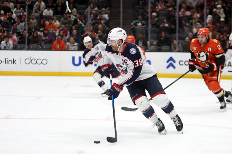 Dec 20, 2025; Anaheim, California, USA;  Columbus Blue Jackets center Boone Jenner (38) controls the puck during the second period against the Anaheim Ducks at Honda Center. Mandatory Credit: Kiyoshi Mio-Imagn Images