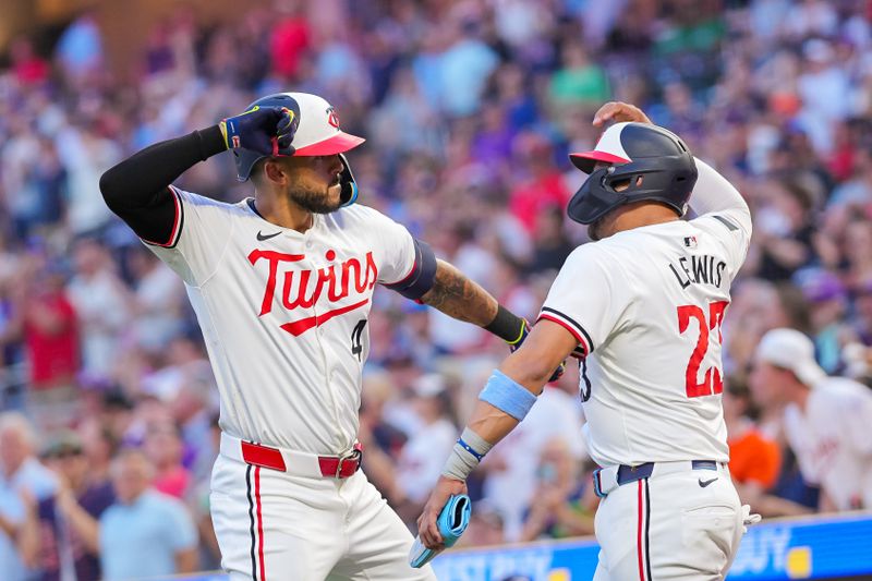 Jun 13, 2024; Minneapolis, Minnesota, USA; Minnesota Twins shortstop Carlos Correa (4) celebrates his home run with third base Royce Lewis (23) against the Oakland Athletics in the seventh inning at Target Field. Mandatory Credit: Brad Rempel-USA TODAY Sports