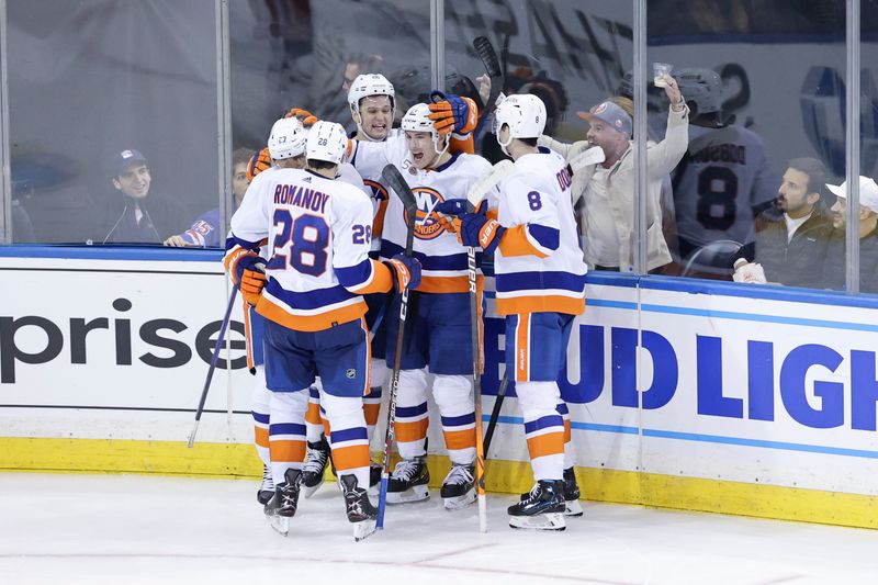 Nov 8, 2022; New York, New York, USA; New York Islanders players celebrate a goal by New York Islanders left wing Anders Lee (27) during the third period of a game agains the New York Rangers at Madison Square Garden. Mandatory Credit: Jessica Alcheh-USA TODAY Sports