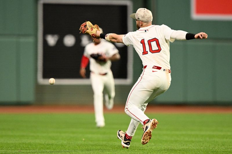 May 17, 2025; Boston, Massachusetts, USA; Boston Red Sox shortstop Trevor Story (10) misses a catch  during the fourth inning against the Atlanta Braves at Fenway Park. Mandatory Credit: Brian Fluharty-Imagn Images