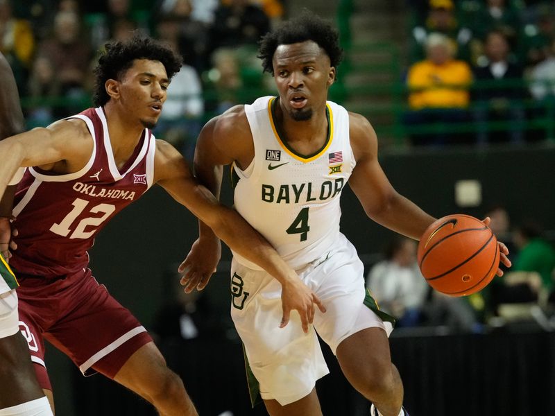 Feb 8, 2023; Waco, Texas, USA; Baylor Bears guard LJ Cryer (4) controls the ball against Oklahoma Sooners guard Milos Uzan (12) during the first half at Ferrell Center. Mandatory Credit: Chris Jones-USA TODAY Sports