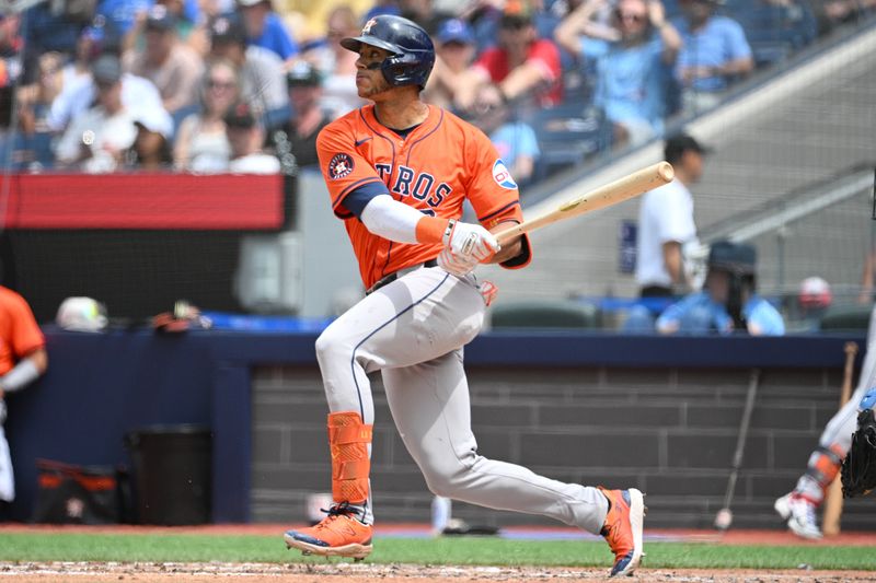 Jul 4, 2024; Toronto, Ontario, CAN; Houston Astros shortstop Jeremy Pena (3) hits a single against the Toronto Blue Jays in the fifth inning at Rogers Centre. Mandatory Credit: Dan Hamilton-USA TODAY Sports