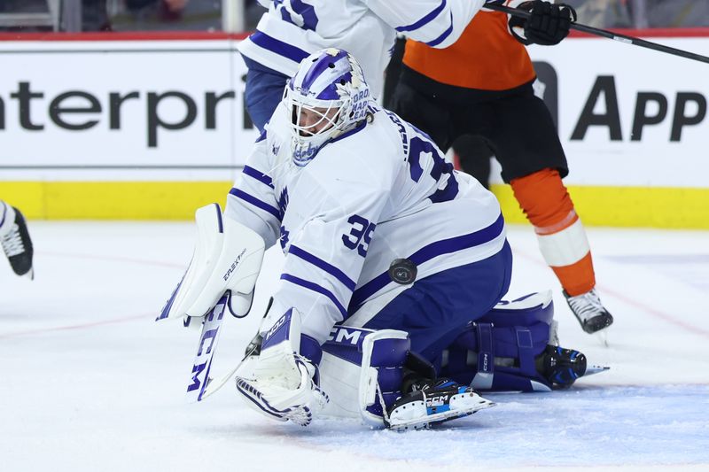 Jan 8, 2026; Philadelphia, Pennsylvania, USA; Toronto Maple Leafs goaltender Dennis Hildeby (35) makes a save against the Philadelphia Flyers during the first period at Xfinity Mobile Arena. Mandatory Credit: Bill Streicher-Imagn Images