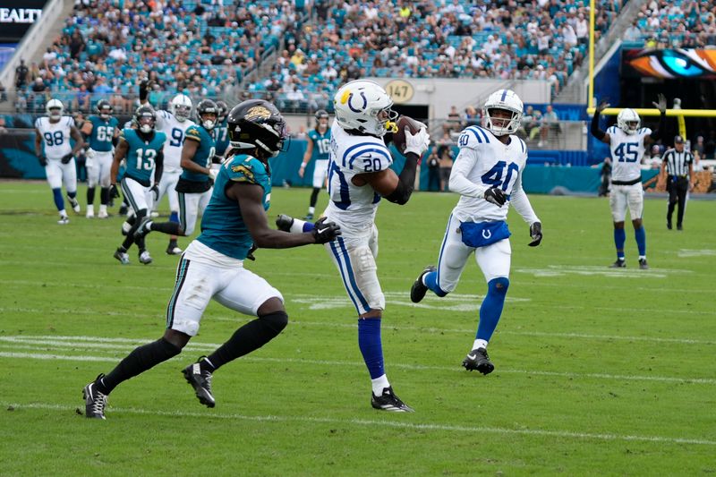 Indianapolis Colts' Nick Cross (20) intercepts a pass intended for Jacksonville Jaguars' Brian Thomas Jr. during the second half of an NFL football game, Sunday, Oct. 6, 2024, in Jacksonville, Fla. (AP Photo/John Raoux)