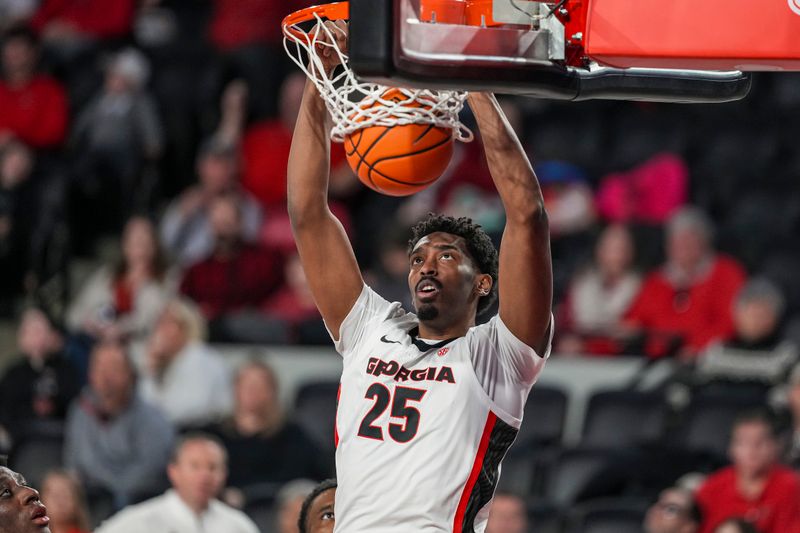 Nov 29, 2025; Athens, Georgia, USA; Georgia Bulldogs forward Justin Abson (25) dunks against the Tennessee Tech Golden Eagles during the second half at Stegeman Coliseum. Mandatory Credit: Dale Zanine-Imagn Images