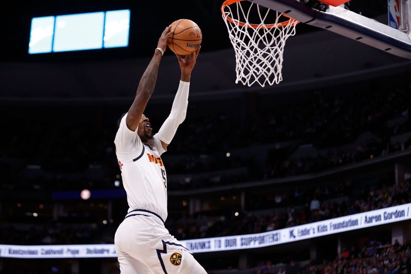 DENVER, COLORADO - FEBRUARY 28: Kentavious Caldwell-Pope #5 of the Denver Nuggets drives to the basket against the Sacramento Kings at Ball Arena on February 28, 2024 in Denver, Colorado. NOTE TO USER: User expressly acknowledges and agrees that, by downloading and or using this photograph, User is consenting to the terms and conditions of the Getty Images License Agreement. (Photo by Brendall O'Banon/Clarkson Creative/Getty Images)