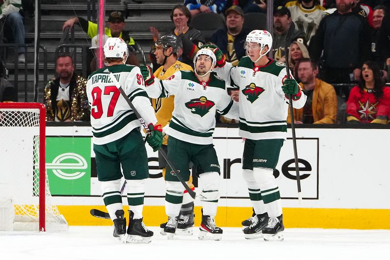 Feb 12, 2024; Las Vegas, Nevada, USA; Minnesota Wild right wing Mats Zuccarello (36) celebrates with Minnesota Wild left wing Kirill Kaprizov (97) and Minnesota Wild center Joel Eriksson Ek (14) after scoring a goal against the Vegas Golden Knights during the first period at T-Mobile Arena. Mandatory Credit: Stephen R. Sylvanie-USA TODAY Sports