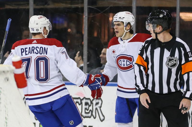 Feb 15, 2024; New York, New York, USA; Montreal Canadiens center Jake Evans (71) is greeted by left wing Tanner Pearson (70) after scoring a goal in the first period against the New York Rangers at Madison Square Garden. Mandatory Credit: Wendell Cruz-USA TODAY Sports