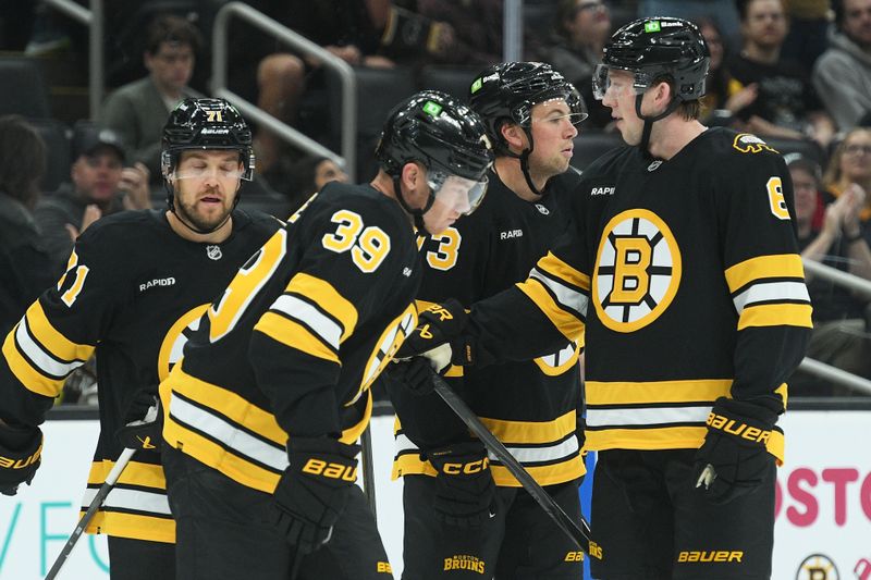 Sep 21, 2025; Boston, Massachusetts, USA; the Boston Bruins celebrate a goal by center Morgan Geekie (39) during the first period against the Washington Capitals at TD Garden. Mandatory Credit: Bob DeChiara-Imagn Images