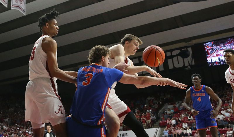 Feb 21, 2024; Tuscaloosa, Alabama, USA;  Florida Gators center Micah Handlogten (3) and Alabama Crimson Tide forward Grant Nelson (2) fight for a rebound at Coleman Coliseum. Mandatory Credit: Gary Cosby Jr.-USA TODAY Sports