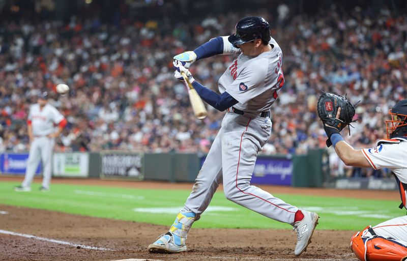 Aug 20, 2024; Houston, Texas, USA; Boston Red Sox first baseman Triston Casas (36) hits an RBI single during the fourth inning against the Houston Astros at Minute Maid Park. Mandatory Credit: Troy Taormina-USA TODAY Sports