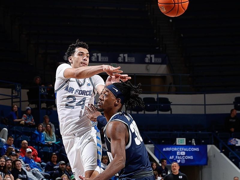 Jan 3, 2023; Colorado Springs, Colorado, USA; Air Force Falcons guard Jeffrey Mills (24) passes the ball over Utah State Aggies forward Dan Akin (30) in the second half at Clune Arena. Mandatory Credit: Isaiah J. Downing-USA TODAY Sports