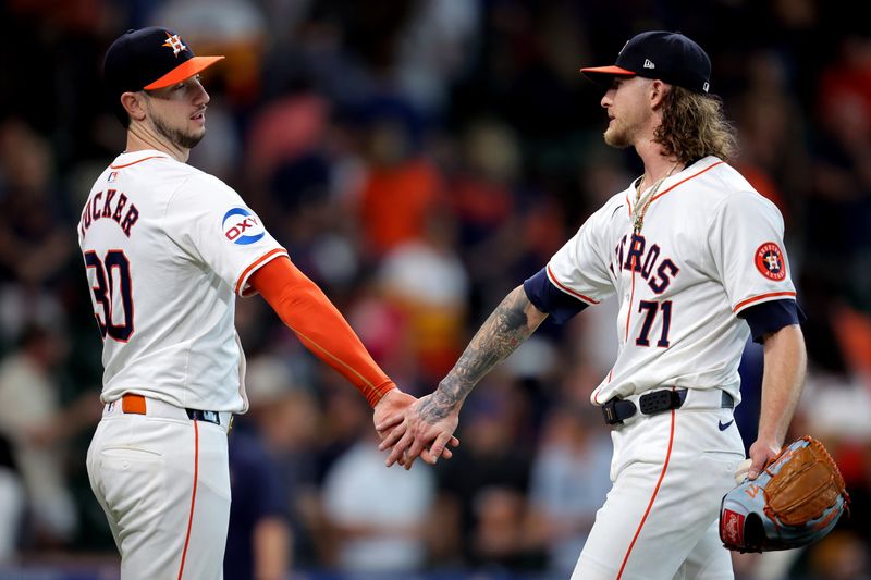 Sep 12, 2024; Houston, Texas, USA; Houston Astros designated hitter Kyle Tucker (30) and Houston Astros relief pitcher Josh Hader (71) congratulate each other after the final out against the Oakland Athletics during the ninth inning at Minute Maid Park. Mandatory Credit: Erik Williams-Imagn Images