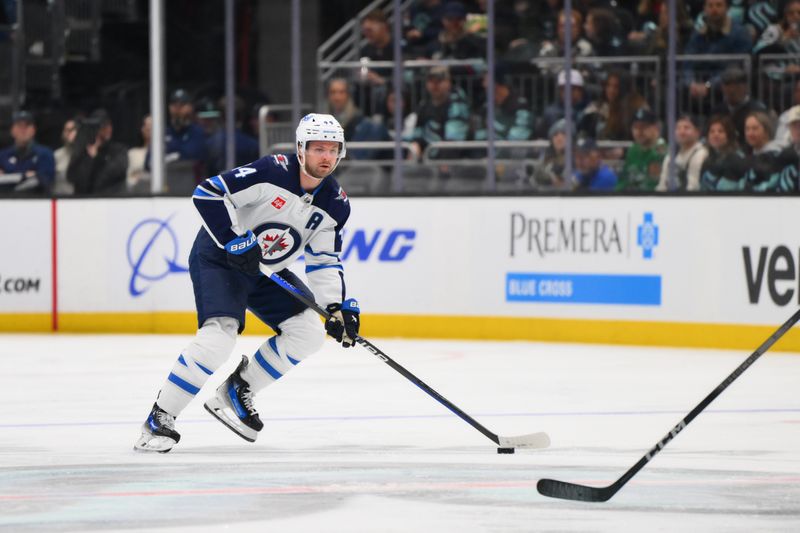 Mar 8, 2024; Seattle, Washington, USA; Winnipeg Jets defenseman Josh Morrissey (44) advances the puck Seattle Kraken during the third period at Climate Pledge Arena. Mandatory Credit: Steven Bisig-USA TODAY Sports