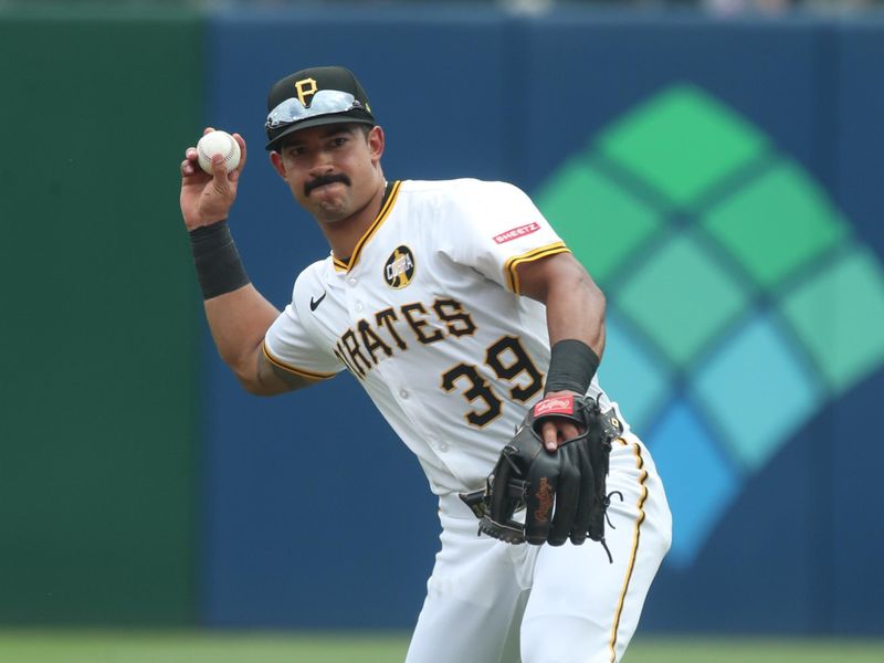 Aug 20, 2025; Pittsburgh, Pennsylvania, USA;  Pittsburgh Pirates second baseman Nick Gonzales (39) throws to first base for an out against Toronto Blue Jays third baseman Addison Barger (not pictured) during the sixth inning at PNC Park. Mandatory Credit: Charles LeClaire-Imagn Images