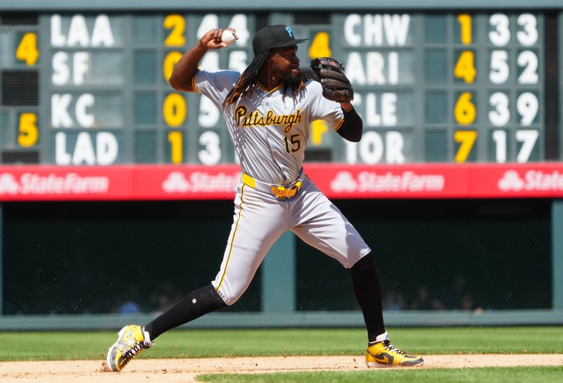 Jun 16, 2024; Denver, Colorado, USA; Pittsburgh Pirates shortstop Oneil Cruz (15) fields the ball in the eighth inning against the Colorado Rockies at Coors Field. Mandatory Credit: Ron Chenoy-USA TODAY Sports