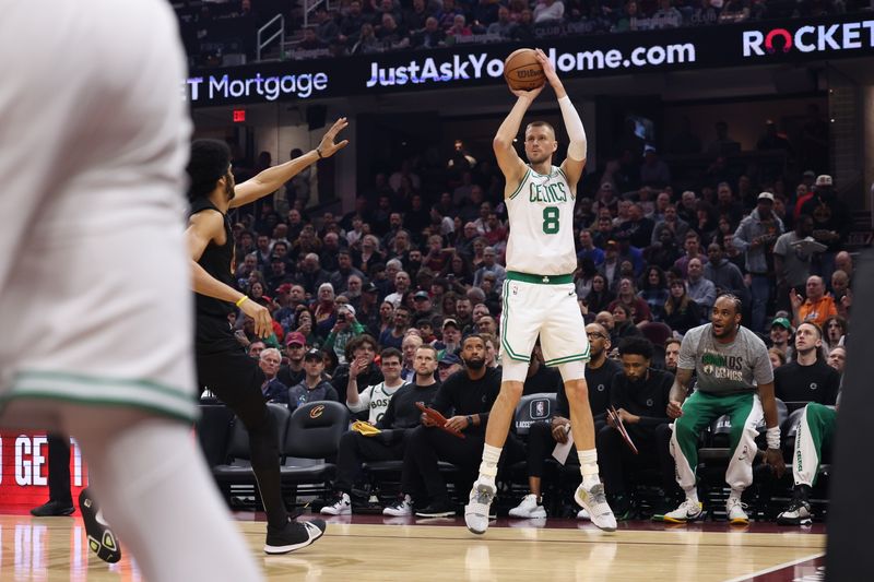 CLEVELAND, OH - MARCH 5: Kristaps Porzingis #8 of the Boston Celtics shoots the ball during the game against the Cleveland Cavaliers on March 5, 2024 at Rocket Mortgage FieldHouse in Cleveland, Ohio. NOTE TO USER: User expressly acknowledges and agrees that, by downloading and/or using this Photograph, user is consenting to the terms and conditions of the Getty Images License Agreement. Mandatory Copyright Notice: Copyright 2024 NBAE (Photo by Lauren Leigh Bacho<p><br/></p>/NBAE via Getty Images)