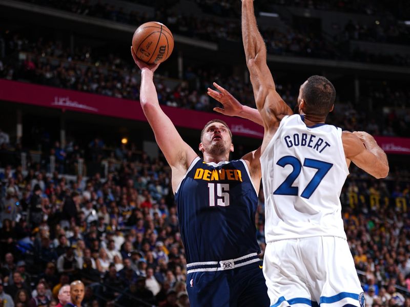 DENVER, CO - APRIL 10: Nikola Jokic #15 of the Denver Nuggets drives to the basket during the game against the Minnesota Timberwolves on April 10, 2024 at the Ball Arena in Denver, Colorado. NOTE TO USER: User expressly acknowledges and agrees that, by downloading and/or using this Photograph, user is consenting to the terms and conditions of the Getty Images License Agreement. Mandatory Copyright Notice: Copyright 2024 NBAE (Photo by Garrett Ellwood/NBAE via Getty Images)