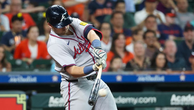 Apr 17, 2024; Houston, Texas, USA; Atlanta Braves third base Austin Riley (27) hits a stand up double against the Houston Astros in the eighth inning at Minute Maid Park. Mandatory Credit: Thomas Shea-USA TODAY Sports